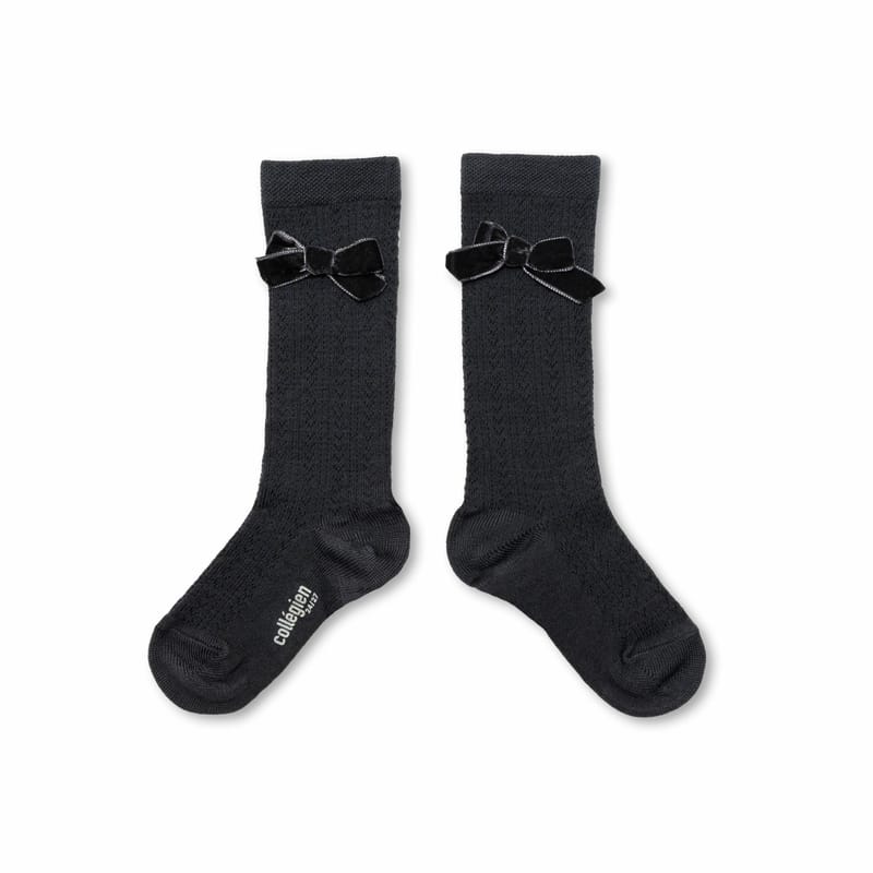 Pointelle merino wool blend knee-high socks with velvet bow by Collégien, crafted in France.