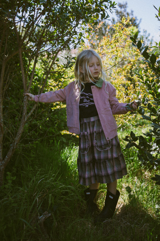 Girls' tartan cotton skirt with frill-trimmed feature pockets, elastic waistband and cotton muslin lining by Little Harper Lee.