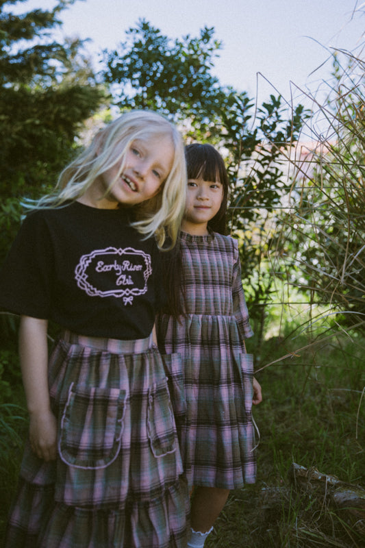 Girls' tartan cotton skirt with frill-trimmed feature pockets, elastic waistband and cotton muslin lining by Little Harper Lee.