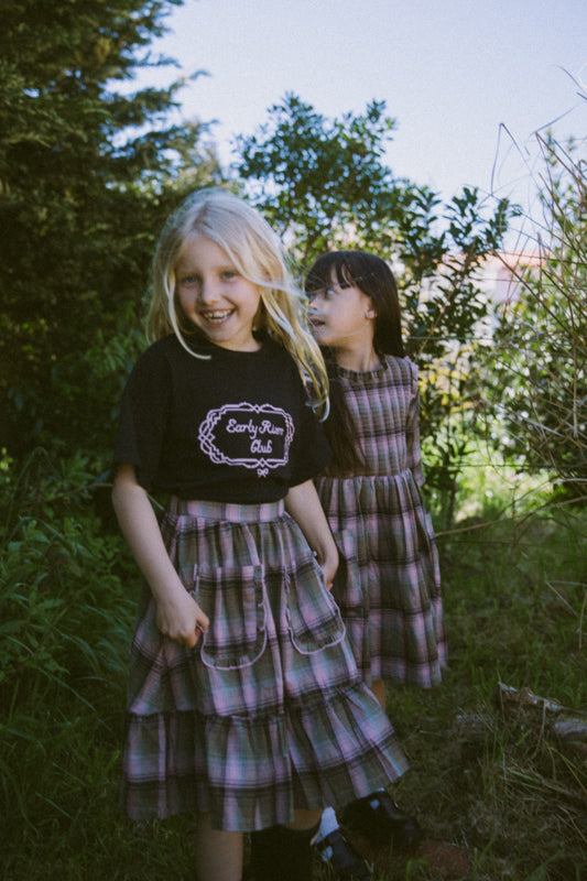Girls' tartan cotton skirt with frill-trimmed feature pockets, elastic waistband and cotton muslin lining by Little Harper Lee.