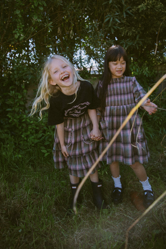 Girls' tartan cotton skirt with frill-trimmed feature pockets, elastic waistband and cotton muslin lining by Little Harper Lee.