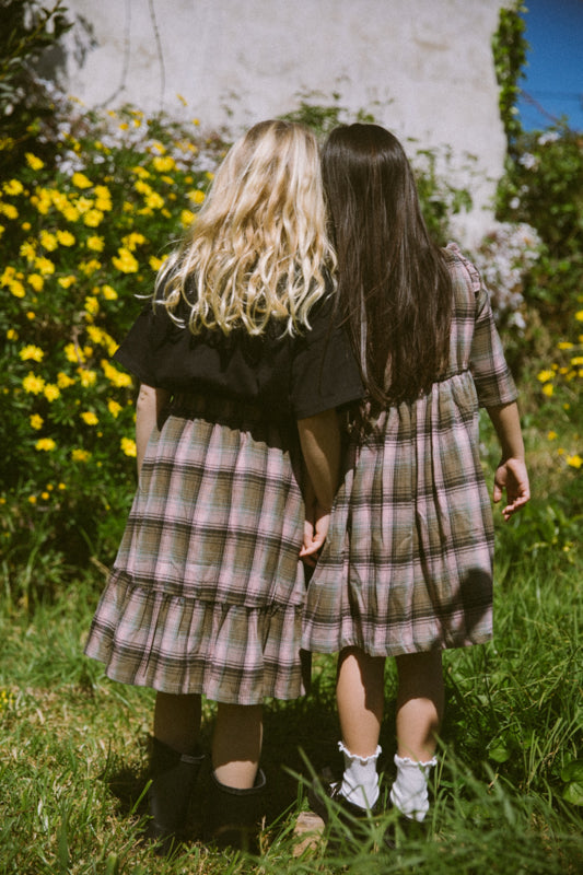 Girls' tartan cotton skirt with frill-trimmed feature pockets, elastic waistband and cotton muslin lining by Little Harper Lee.